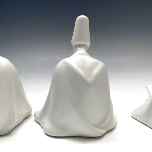 882 - Three Yildiz Imperial porcelain figures of Sufi Muslim musicians, height 13cm.