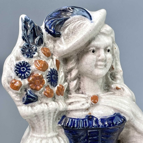 883 - A pair of Victorian Staffordshire flatback figures, of a young man and his companion, each beside a ... 