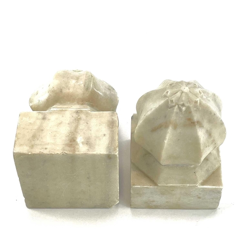 A pair of Indian white marble carpet weights, 19th century, heights 19