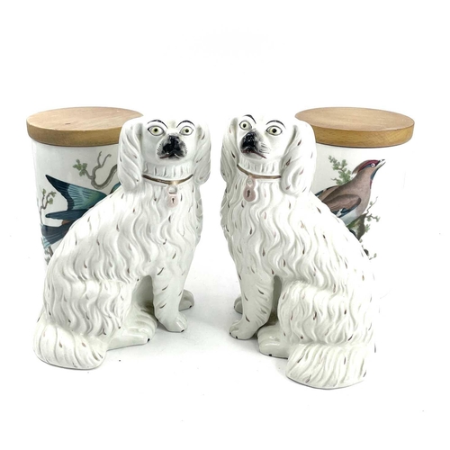 868 - A pair of Staffordshire pottery spaniels decorated with brown flecks and a padlock together with two... 