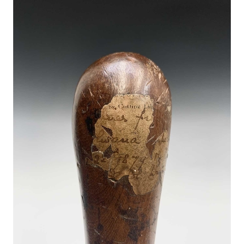 1 - A 19th century hardwood knobkerrie of typical form, with remnants of handwritten note attached and d... 