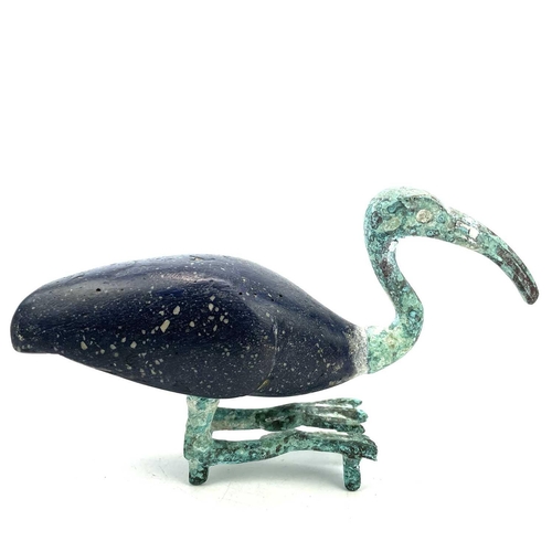 10 - Egyptian style, after the Ptolemaic period A bronze and glass figure of a resting ibis, height 13.5c... 