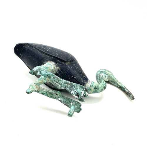 10 - Egyptian style, after the Ptolemaic period A bronze and glass figure of a resting ibis, height 13.5c... 