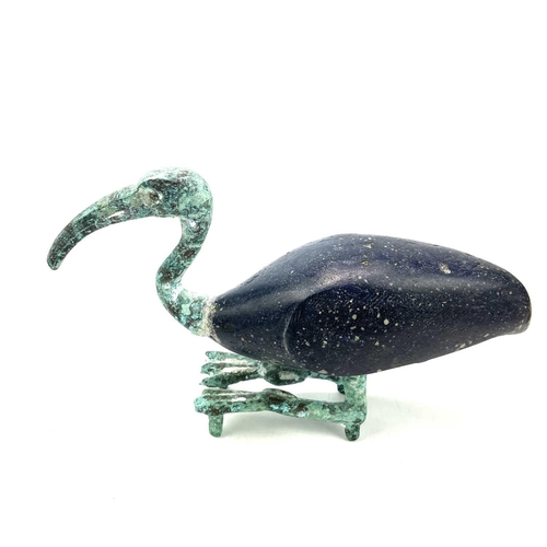 10 - Egyptian style, after the Ptolemaic period A bronze and glass figure of a resting ibis, height 13.5c... 