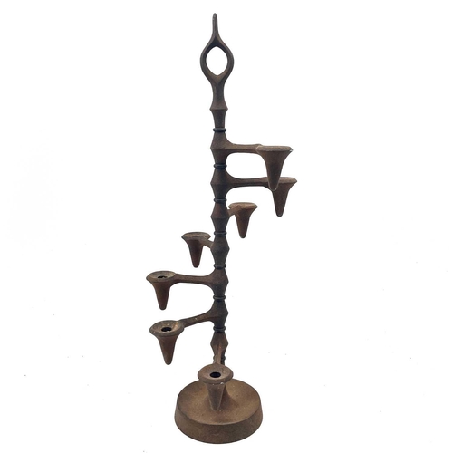 100 - Jens Quistgaard (1919-2008) A cast iron candle tree for Dansk, Denmark, with seven stepped sconces, ... 