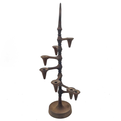 100 - Jens Quistgaard (1919-2008) A cast iron candle tree for Dansk, Denmark, with seven stepped sconces, ... 