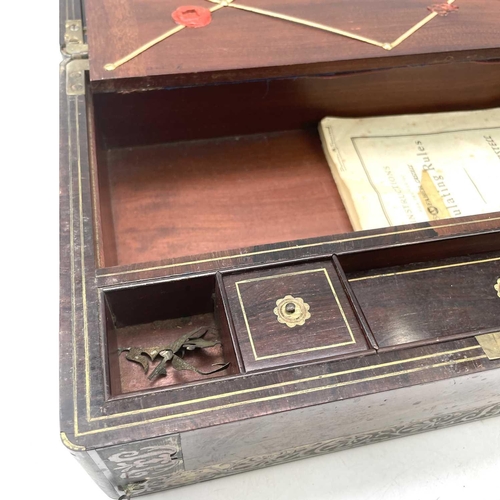 101 - A William IV rosewood and brass inlaid writing slope, with fitted interior including secret drawers ... 