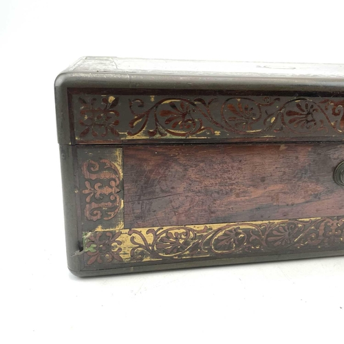 101 - A William IV rosewood and brass inlaid writing slope, with fitted interior including secret drawers ... 