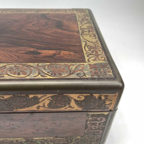 101 - A William IV rosewood and brass inlaid writing slope, with fitted interior including secret drawers ... 