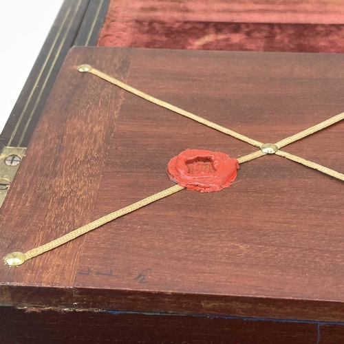 101 - A William IV rosewood and brass inlaid writing slope, with fitted interior including secret drawers ... 