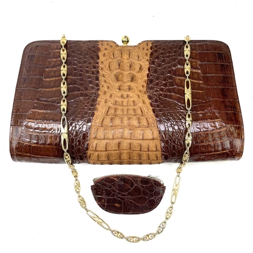 109 - A 1930s/1940s two tone crocodile skin handbag with gilt metal strap. Width 27.5cm.