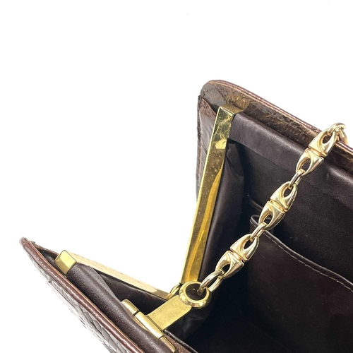 109 - A 1930s/1940s two tone crocodile skin handbag with gilt metal strap. Width 27.5cm.