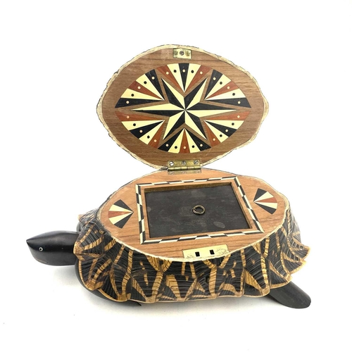 11 - An Anglo-Indian turtle form trinket box, early 20th century, with star tortoiseshell cover and inlai... 