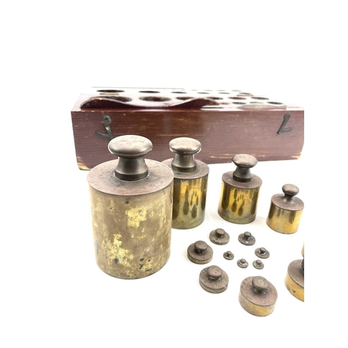 111 - A cased set of metric brass weights, the box labelled BTL, ranging from 1gram to 2Kg, with lifter an... 