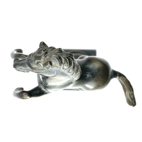 117 - A brass rearing stallion on a pedestal base, height 17cm.