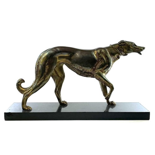 12 - After Rochard a cast metal Borzoi. A French gilded figure of a Borzoi hound, circa 1930, modelled wi... 