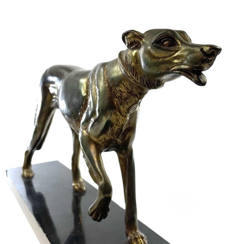 12 - After Rochard a cast metal Borzoi. A French gilded figure of a Borzoi hound, circa 1930, modelled wi... 