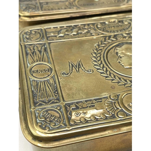 127 - A WW I brass Princess Mary 1914 Christmas tin together with another similar. 13cm x 8.5cm. (2)