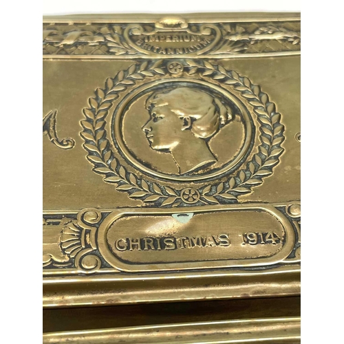 127 - A WW I brass Princess Mary 1914 Christmas tin together with another similar. 13cm x 8.5cm. (2)