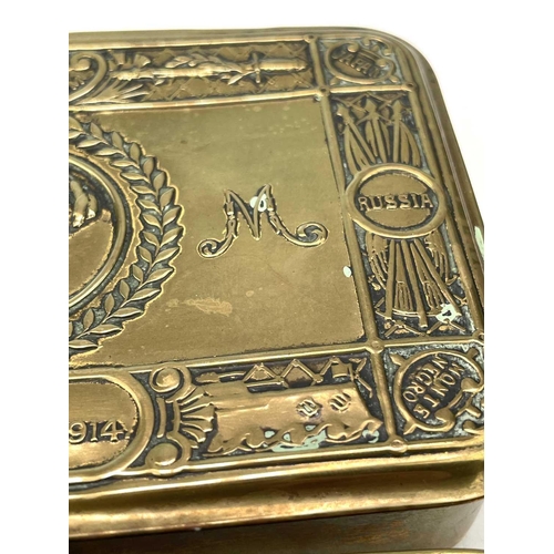 127 - A WW I brass Princess Mary 1914 Christmas tin together with another similar. 13cm x 8.5cm. (2)