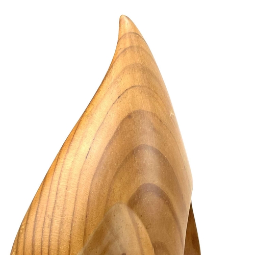 129 - A Ron Lane cedar wood carving, open abstract design, height 33cm, together with a carved walnut otte... 