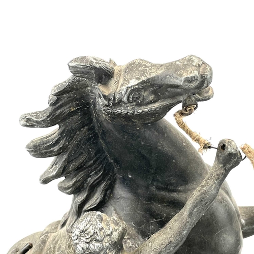 132 - A pair of spelter Marly horses, French, circa 1900, raised on slate plinth bases with applied bronze... 