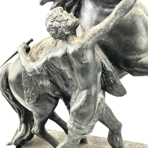 132 - A pair of spelter Marly horses, French, circa 1900, raised on slate plinth bases with applied bronze... 