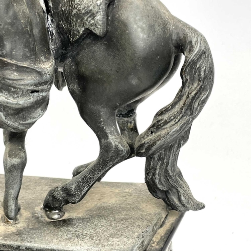 132 - A pair of spelter Marly horses, French, circa 1900, raised on slate plinth bases with applied bronze... 