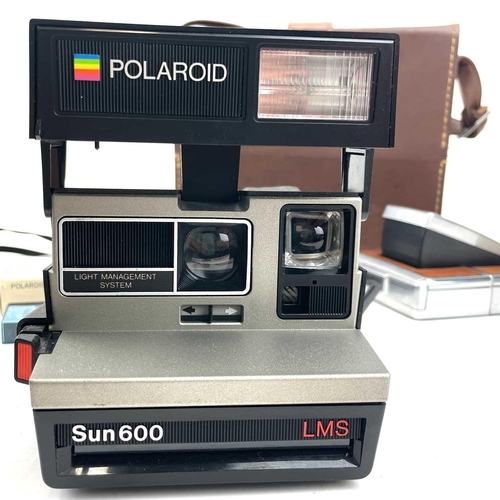 133 - A Polaroid SX-70 Land Camera in a leather carry case together with a Polaroid Sun 600 Land Camera.