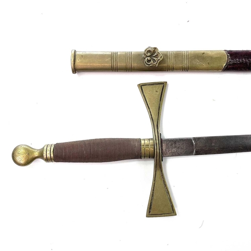 135 - A Masonic type ceremonial sword, with brass crosspiece and brass mounted leather scabbard, length 87... 