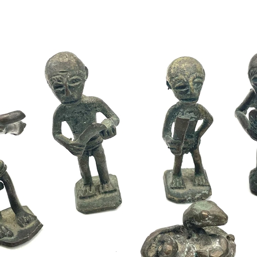 138 - Eight Ashanti bronze small figures, late 19th/early 20th century, the largest height 6cm, together w... 