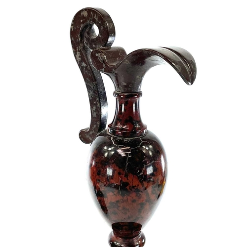 146 - A serpentine carved and polished ewer on a serpentine plinth base height 28.5cm together with a bras... 