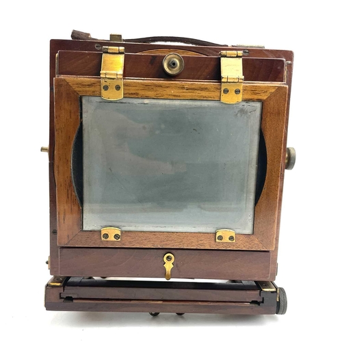 151 - A W.Butcher & Sons National Camera, 1/4 plate folding camera together with a plate negative of a fam... 