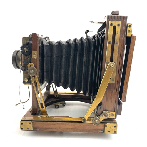 151 - A W.Butcher & Sons National Camera, 1/4 plate folding camera together with a plate negative of a fam... 