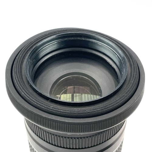 156 - A Canon Zoom EF 75-300mm 1:4-5.6 III USM serial number 45108830 together with a Sigma Zoom 28-135mm ... 