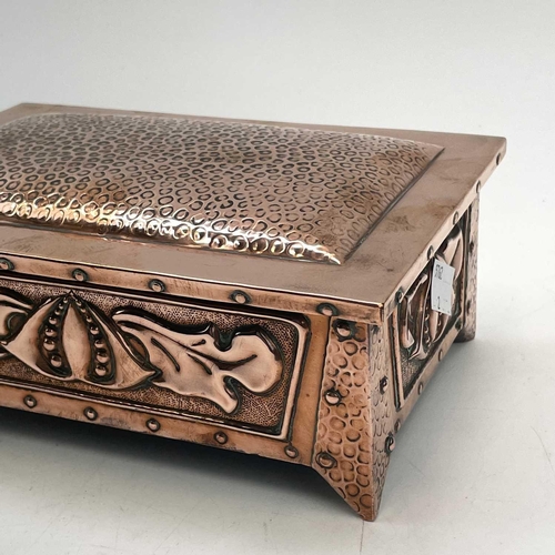 160 - An Arts and Crafts copper box and cover, probably Hayle, repousse decorated with stylised flowers an... 