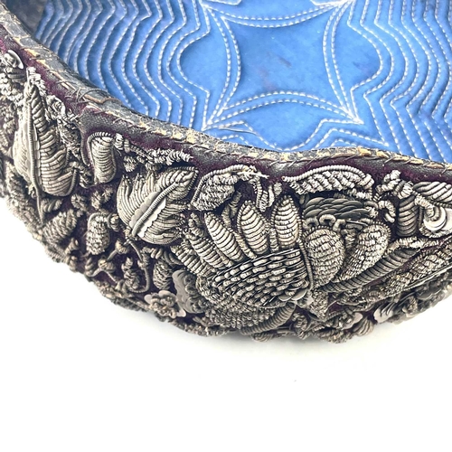 1606 - A circa 1900 Indian possibly Hyperbad topi elaborately decorated in silver thread on velvet ground d... 