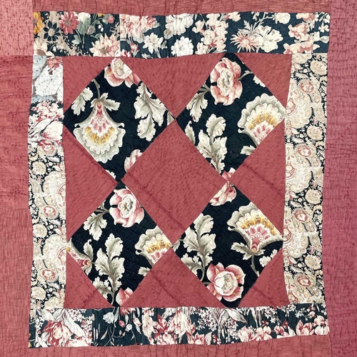 1607 - An early 20th century Durham patchwork quilt 190cm x 172cm.