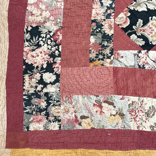 1607 - An early 20th century Durham patchwork quilt 190cm x 172cm.