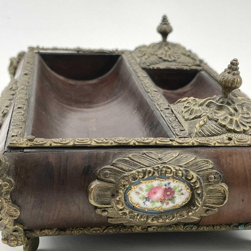 161 - A French kingwood and gilt brass mounted desk stand, with two lidded compartments and Paris porcelai... 