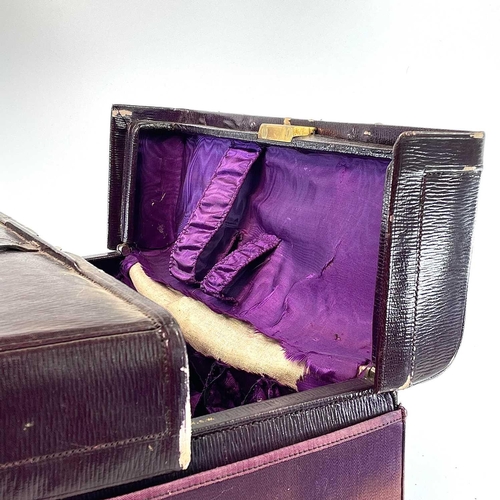 1610 - An early 20th century Harrods Ltd plum leather Gladstone type vanity case with purple silk inner lin... 