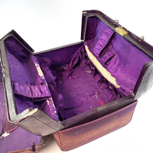 1610 - An early 20th century Harrods Ltd plum leather Gladstone type vanity case with purple silk inner lin... 