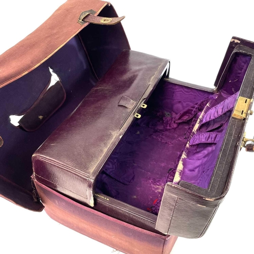 1610 - An early 20th century Harrods Ltd plum leather Gladstone type vanity case with purple silk inner lin... 