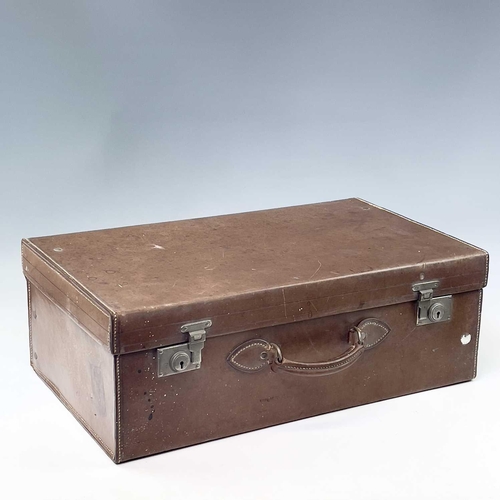 1611 - A late Victorian tan leather vanity case with a fitted interior including six silver topped toilet b... 