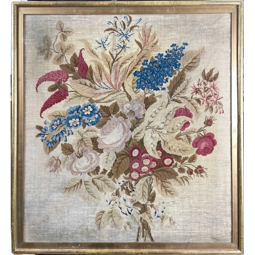 1614 - A 19th century woolwork embroidery of a floral display, 67cm x 61cm.