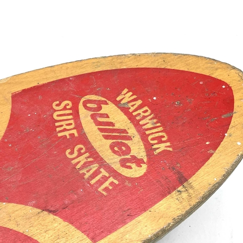 162 - A circa 1960s bullet Warwick Surf Skate skateboard, length 59cm.