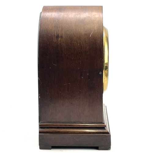 1713 - A mahogany and inlaid lancet shape mantel clock, circa 1900, with silvered dial, striking on two gon... 