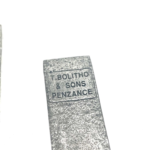 175 - Two miniture T. Bolitho & Sons Penzance copy tin ingots by St Justin, the largest 9 x 2.5cm.