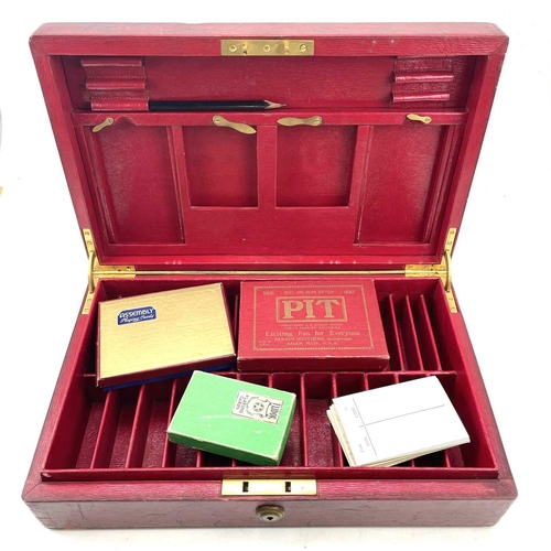 18 - A red Morocco leather games box, by Clark, 20, Bond Street, monogrammed AW for Alfred Wagg, with gil... 