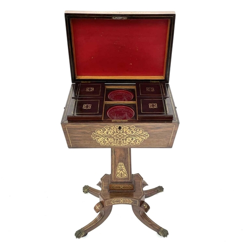 1801 - A Regency rosewood and brass inlaid teapoy, with sarcophagus shaped top enclosing four lidded compar... 